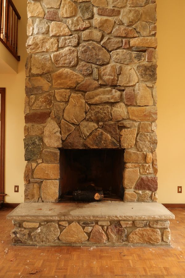 A stone masonry fireplace in an Anderson, IN home